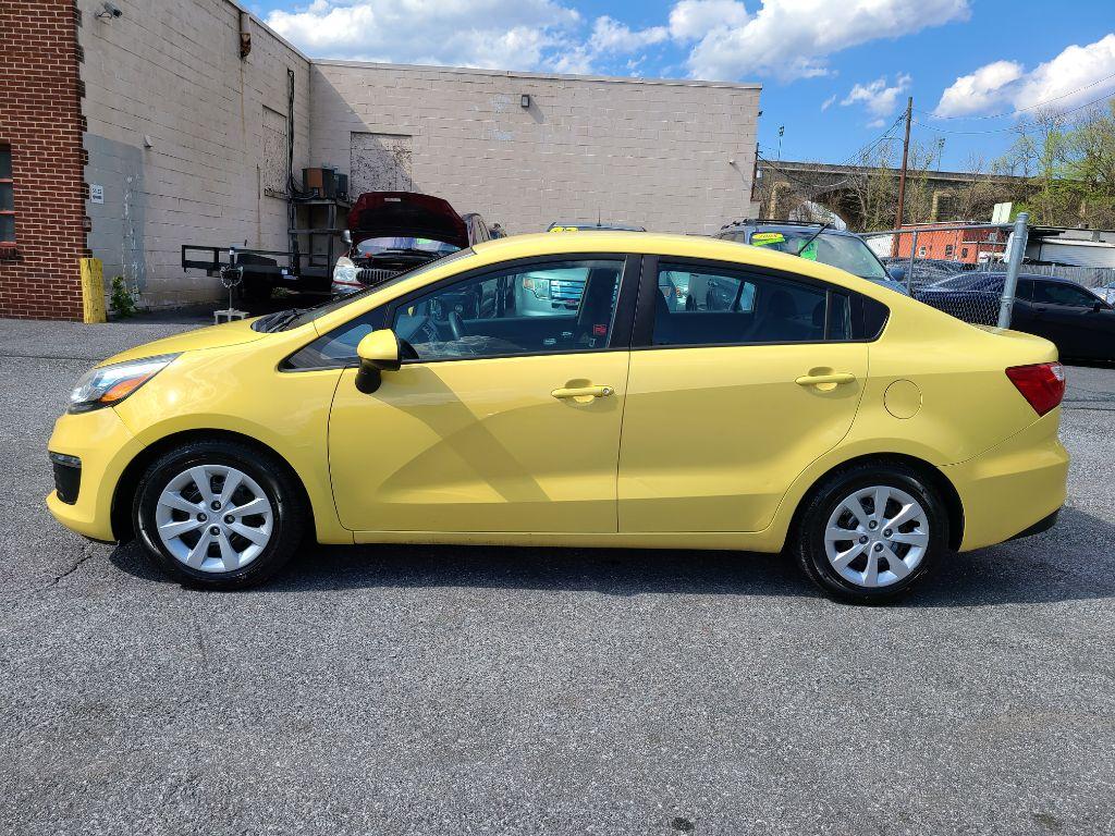 2016 YELLOW KIA RIO LX (KNADM4A32G6) with an 1.6L engine, 6-Speed Manual transmission, located at 117 North Cameron Street, Harrisburg, PA, 17101, (717) 963-8962, 40.267021, -76.875351 - Photo #1
