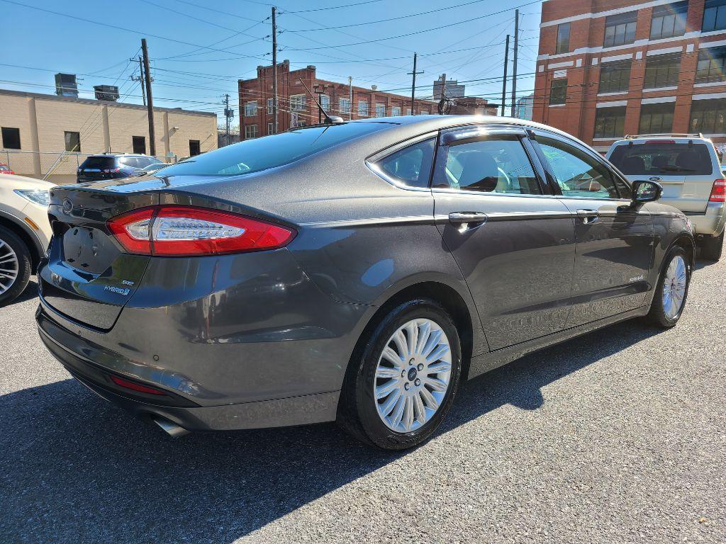 2015 GRAY FORD FUSION SE HYBRID (3FA6P0LU0FR) with an 2.0L engine, Continuously Variable transmission, located at 7981 Paxton Street, Harrisburg, PA, 17111, (717) 561-2926, 40.261490, -76.749229 - Photo #4